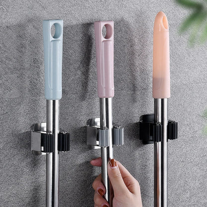 "Suporte Adesivo Inox para Vassouras – Resistente e Prático"